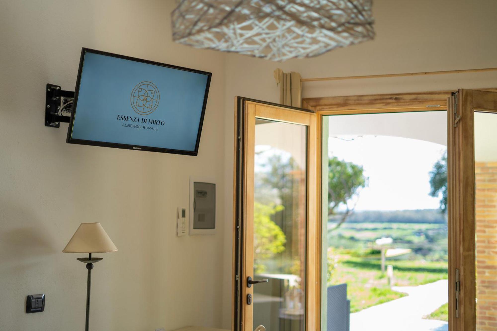 Hotel Essenza Di Mirto La Caletta Chambre photo